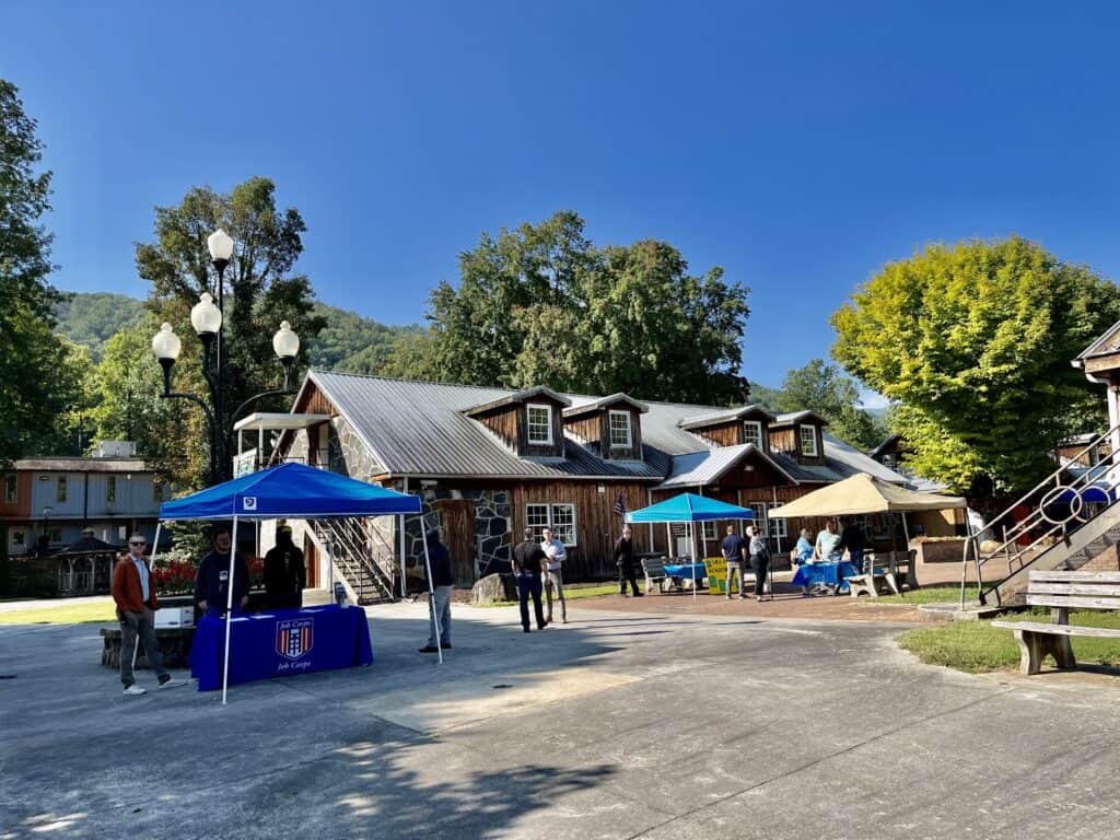 Community partnership event at Macon Sense with students and vendors outdoors.