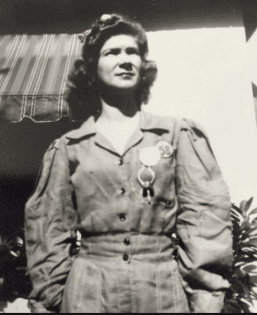 Historic photo of a centenarian woman in uniform celebrating her 100th birthday.