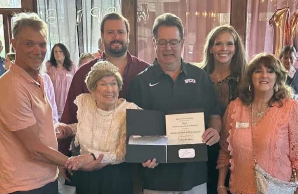 Centenarian 'Rosies' celebrating milestone birthday with family and friends.