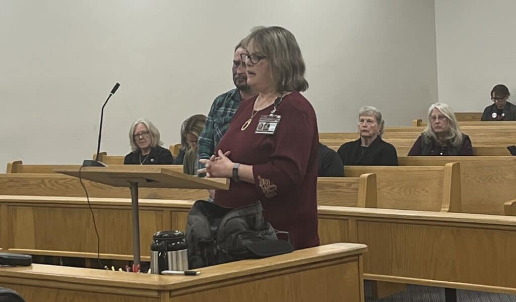 Commissioners' meeting in progress with tense atmosphere and low progress.