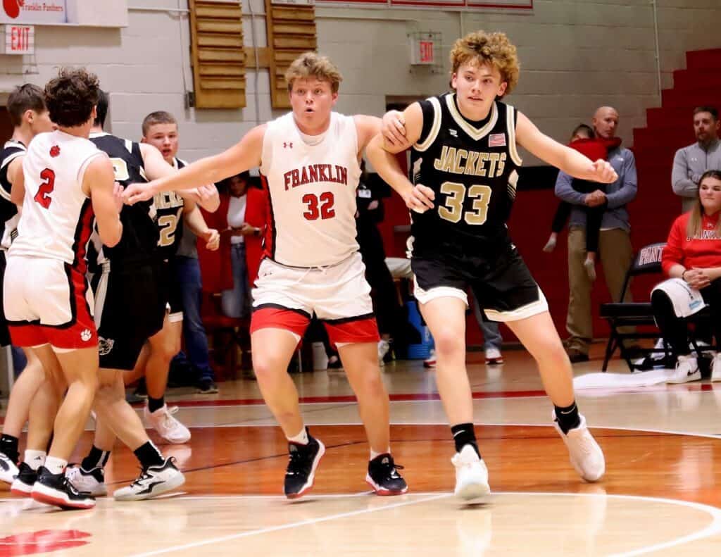 Franklin High School basketball players competing in a game.