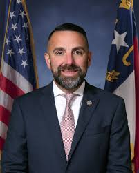 Sheriff and police chief volunteering at Cold for a Cause charity event.