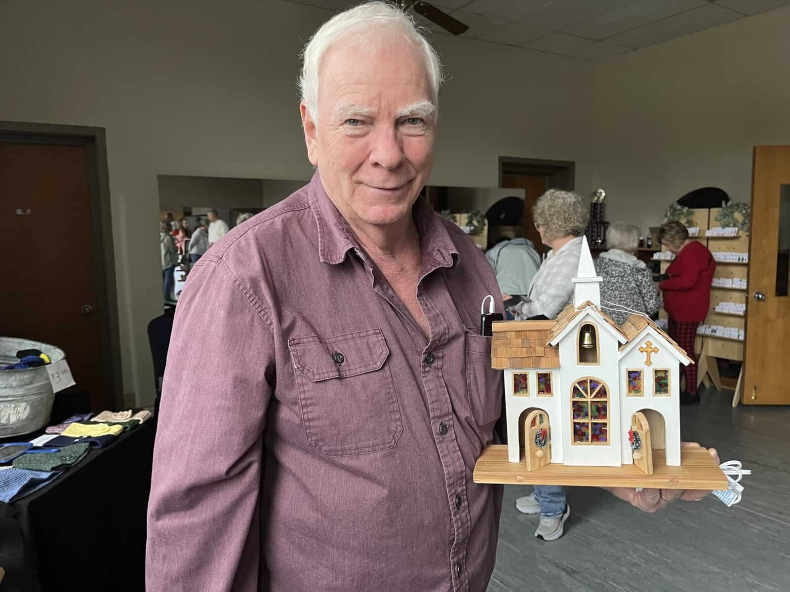 Churches and log cabins favorite subjects for local woodworker