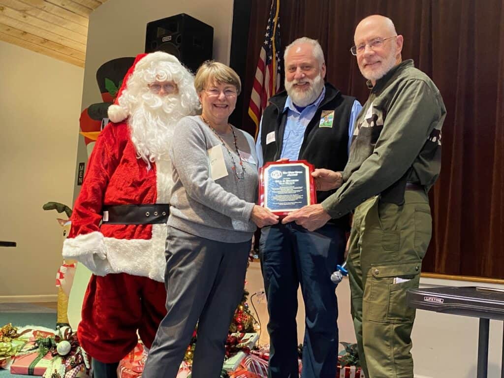 Van Horns receive NHC award in their honor at Macon Sense event.