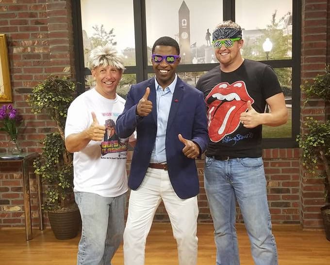 Diverse group celebrating community engagement and empowerment in Macon Sense.