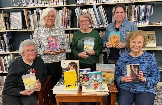Democratic women donate books to schools