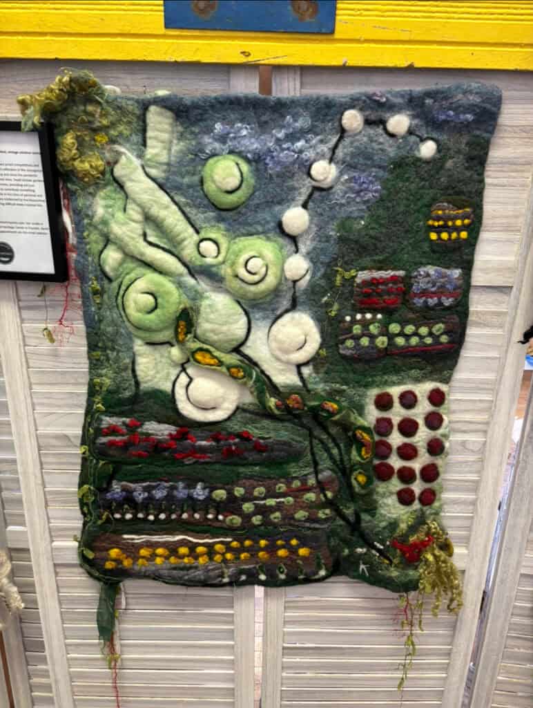 Wool art piece by Kim Keelor showcasing textured, colorful wool techniques.