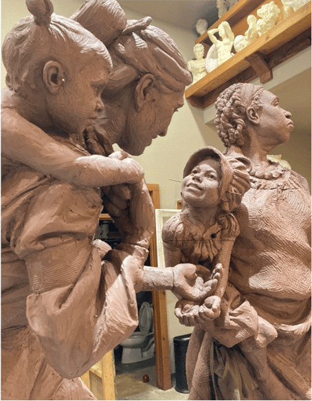Sculpture of women honoring Macon County's legacy, unveiled during a special ceremony.