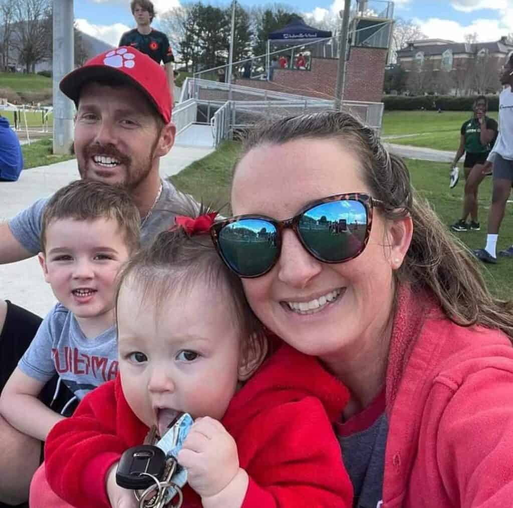 Coach Matt Harlfinger supporting FHS runners during track practice.