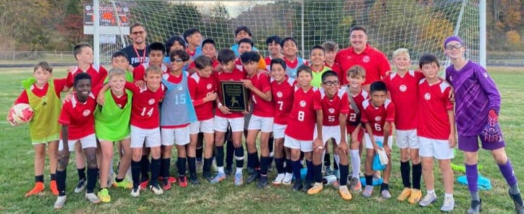 MMS soccer team celebrating championship victory after a hard-fought season.