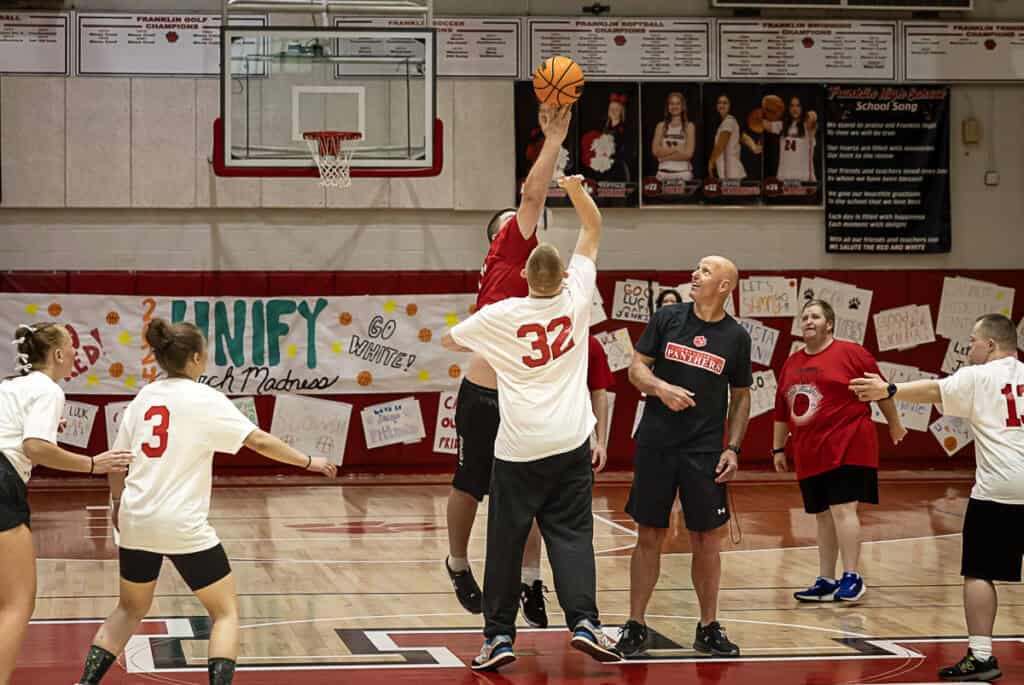 Youth basketball game at FHS Unify March Madness event.