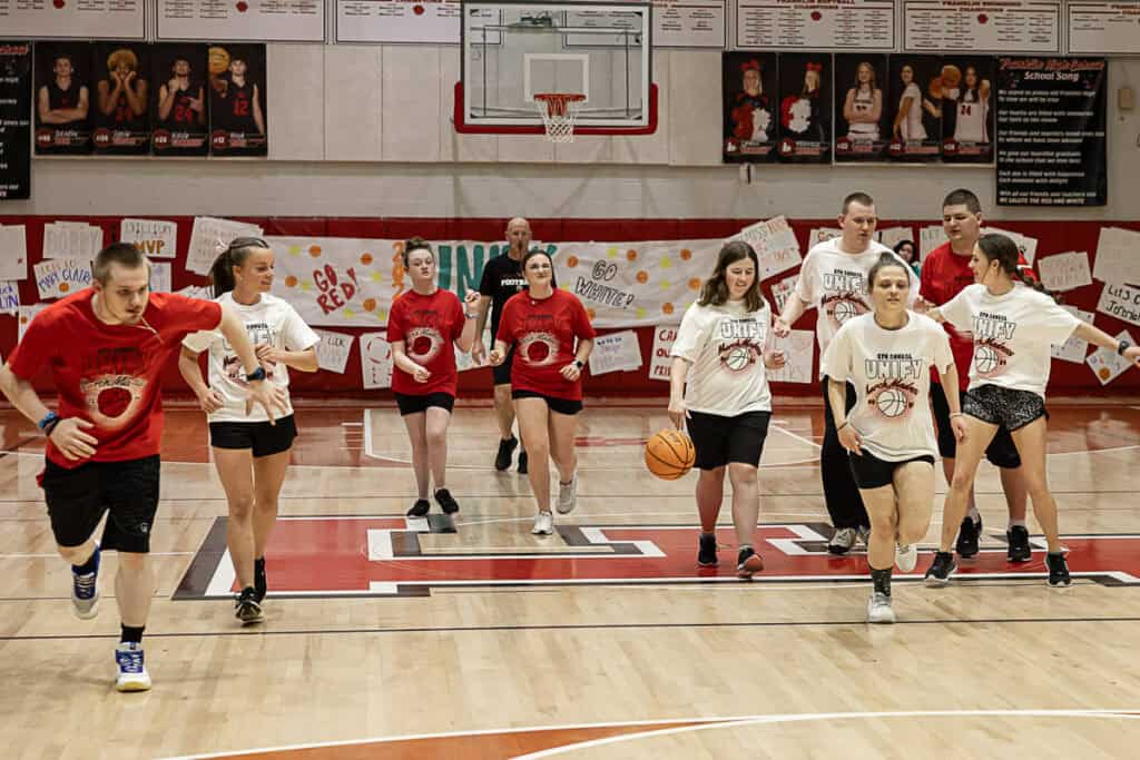 FHS students participating in March Madness basketball event at the gym.