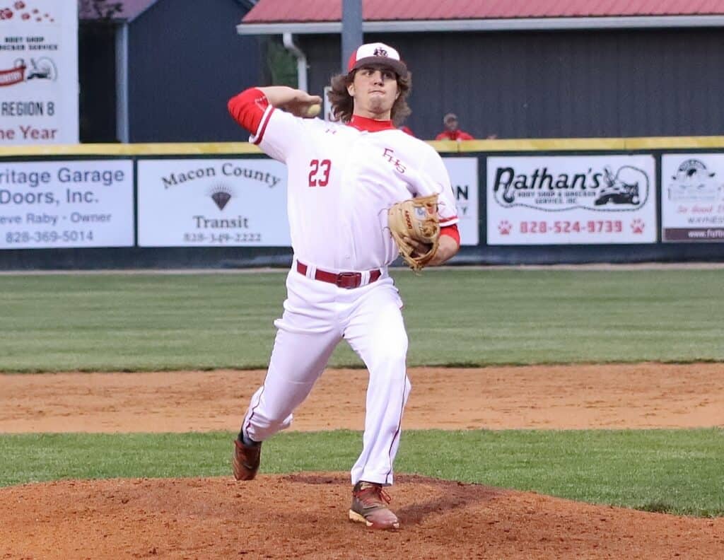 Softball pitcher from Macon Sense team in action during a game.