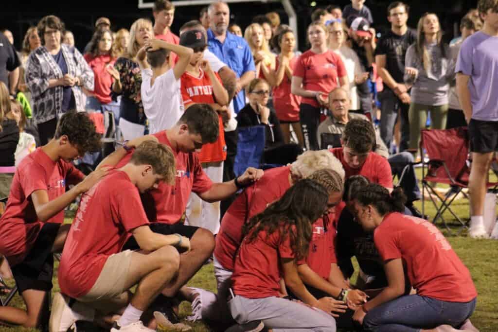 Crowd of more than 500 gathers at the first Fields of Faith event, emphasizing community faith and y.