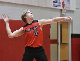 Female volleyball player in action during a match at Macon Sense.