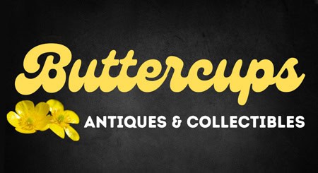 Antiques and collectibles shop sign with yellow buttercup flowers.