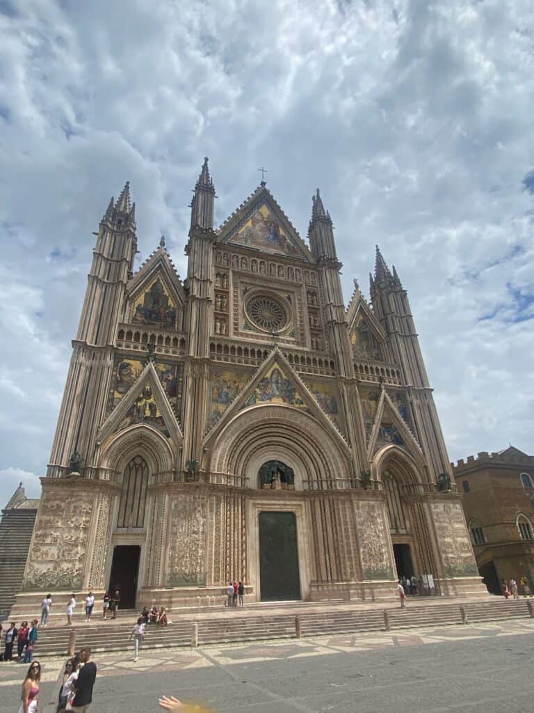 Gothic cathedral in Italy with intricate architecture and towering spires, part of FHS students' tra.