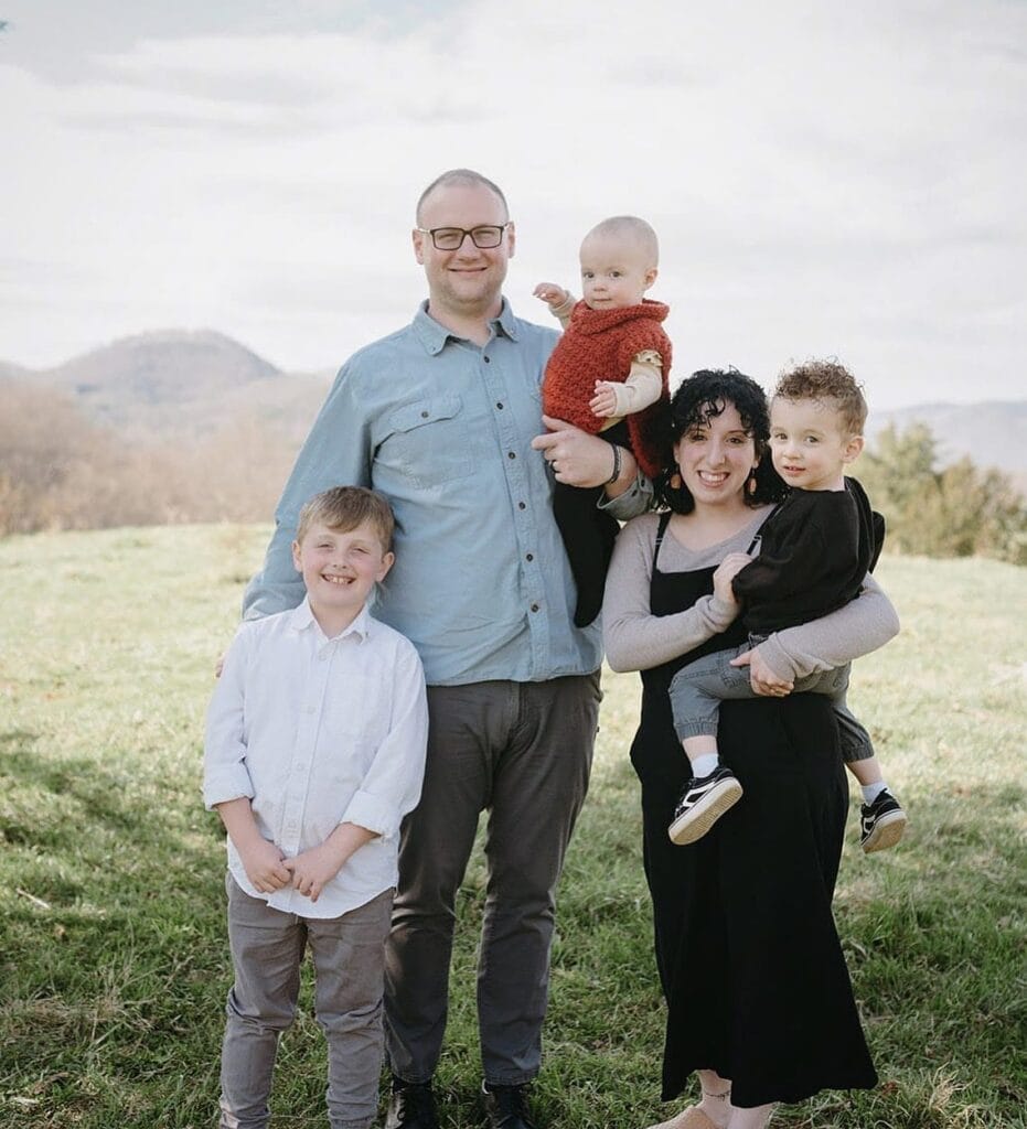 Family with children outdoors, symbolizing strength and unity for future challenges.