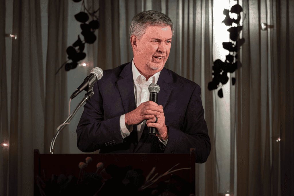 Man speaking at Macon Sense event during SMPCC annual fundraiser.