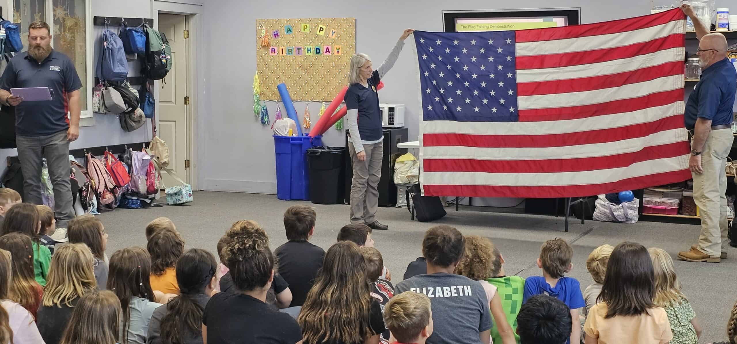 Students given a lesson in “broad stripes and bright stars”