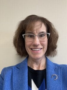 Female doctor smiling, representing new healthcare providers in Macon County.