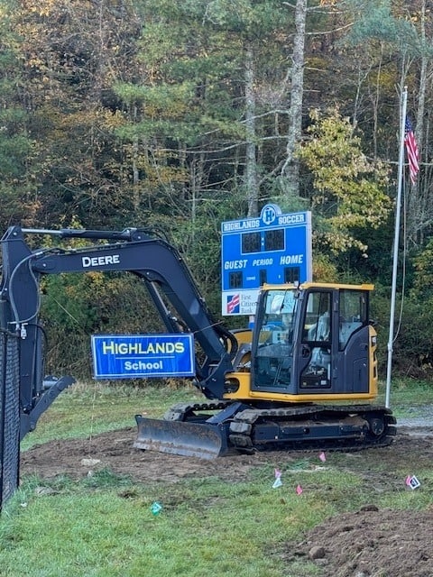 Excavator at Highlands School construction site for renovations.