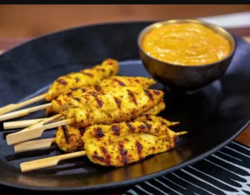 Gluten-free chicken skewers with flavorful marinade served with spicy dipping sauce. Perfect for low.