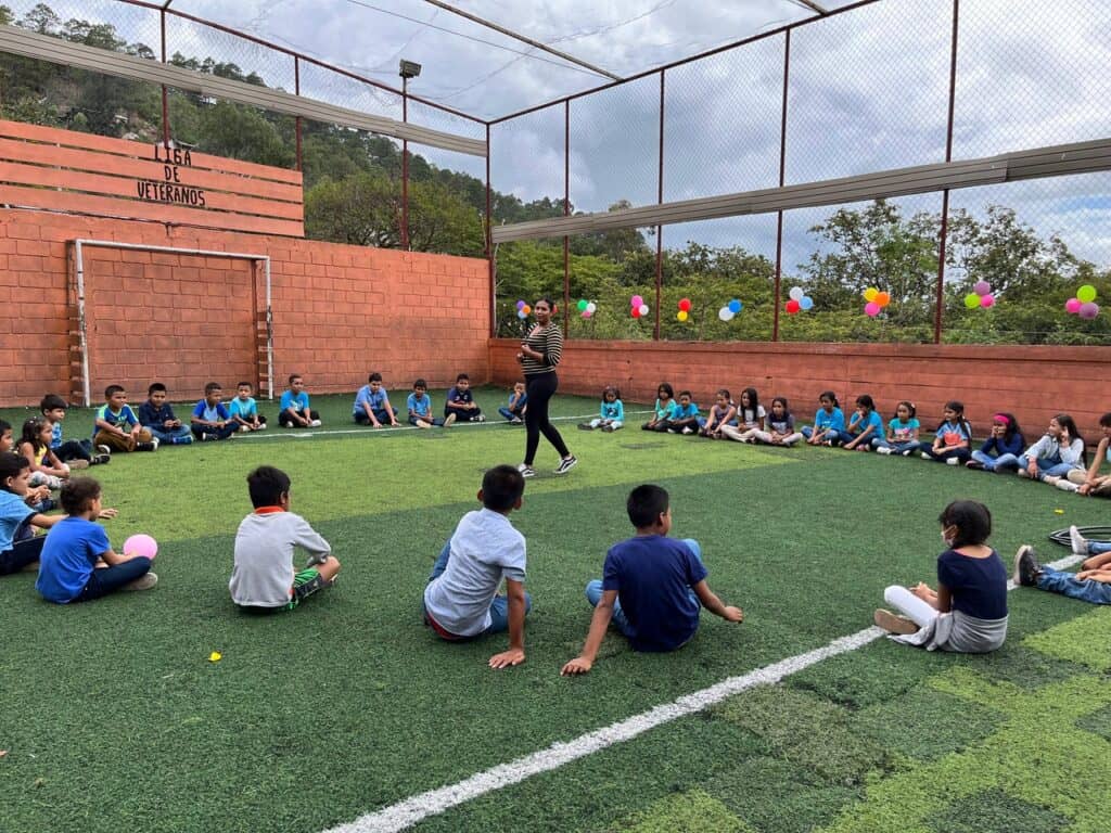 Honduran mission team engages children during a 12-year project effort.
