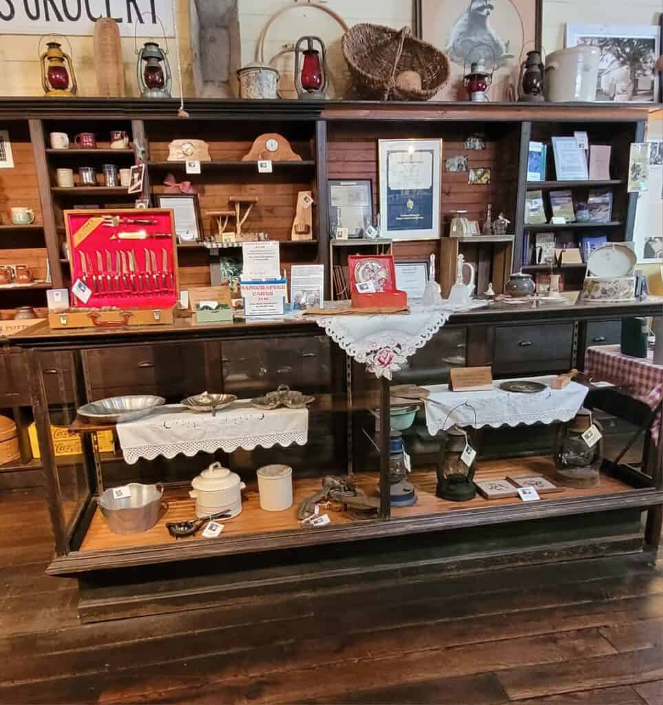 Vintage store display showcasing antique kitchenware and collectibles at Macon Sense, celebrating 10.