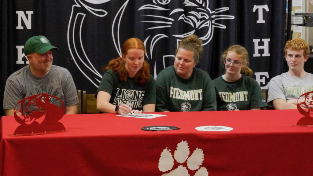 FHS students signing their future plans at a school event.