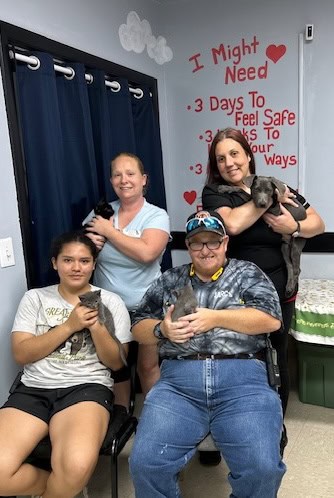 Volunteers with rescued cats at Macon Sense animal shelter.