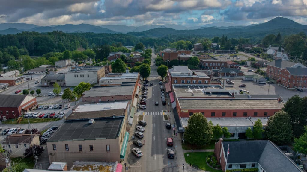 Main Street in town with cars and traffic calming measures in place.