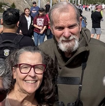 Happy grandparents at outdoor event celebrating family legacy and heritage.