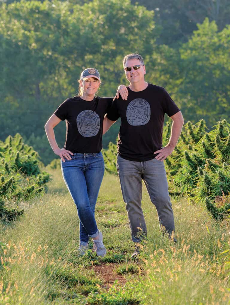 Entrepreneurs grounded in community standing together outdoors.