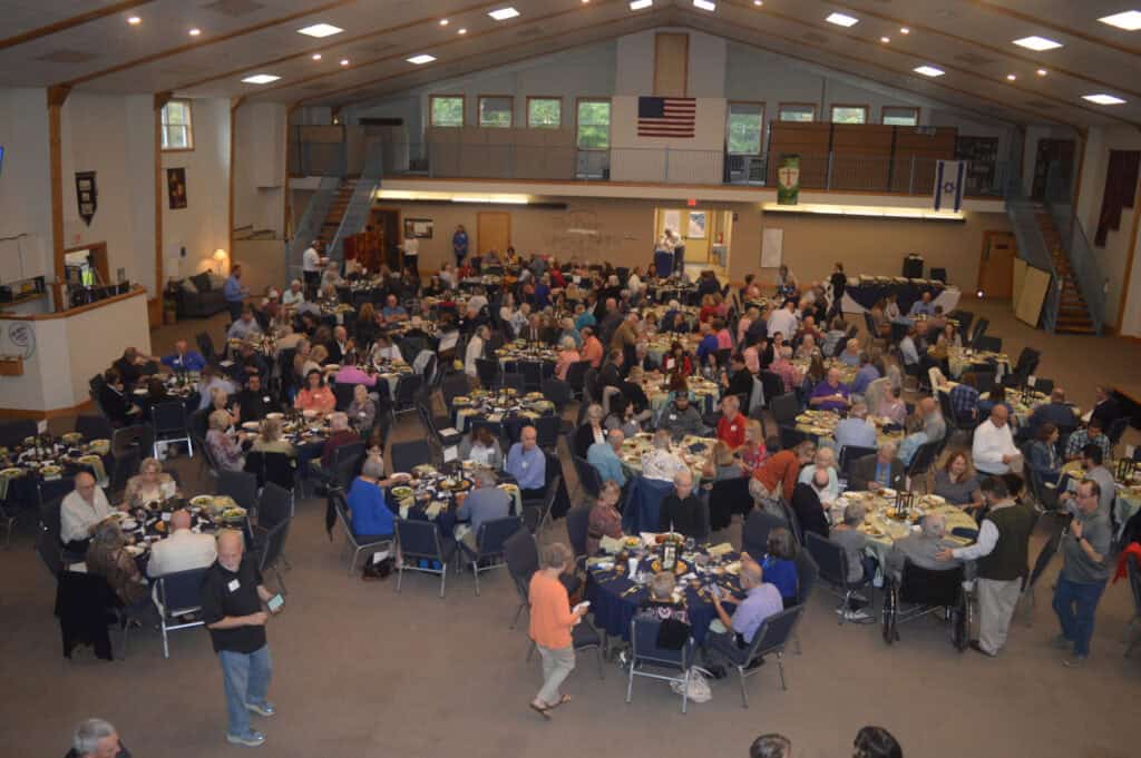 Event gathering with numerous attendees at Macon Sense Events Calendar.