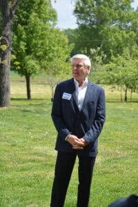 American founding father descendant at patriotic event in a park.
