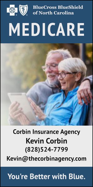 Senior couple reviewing Medicare options outdoors, smiling and using a tablet.