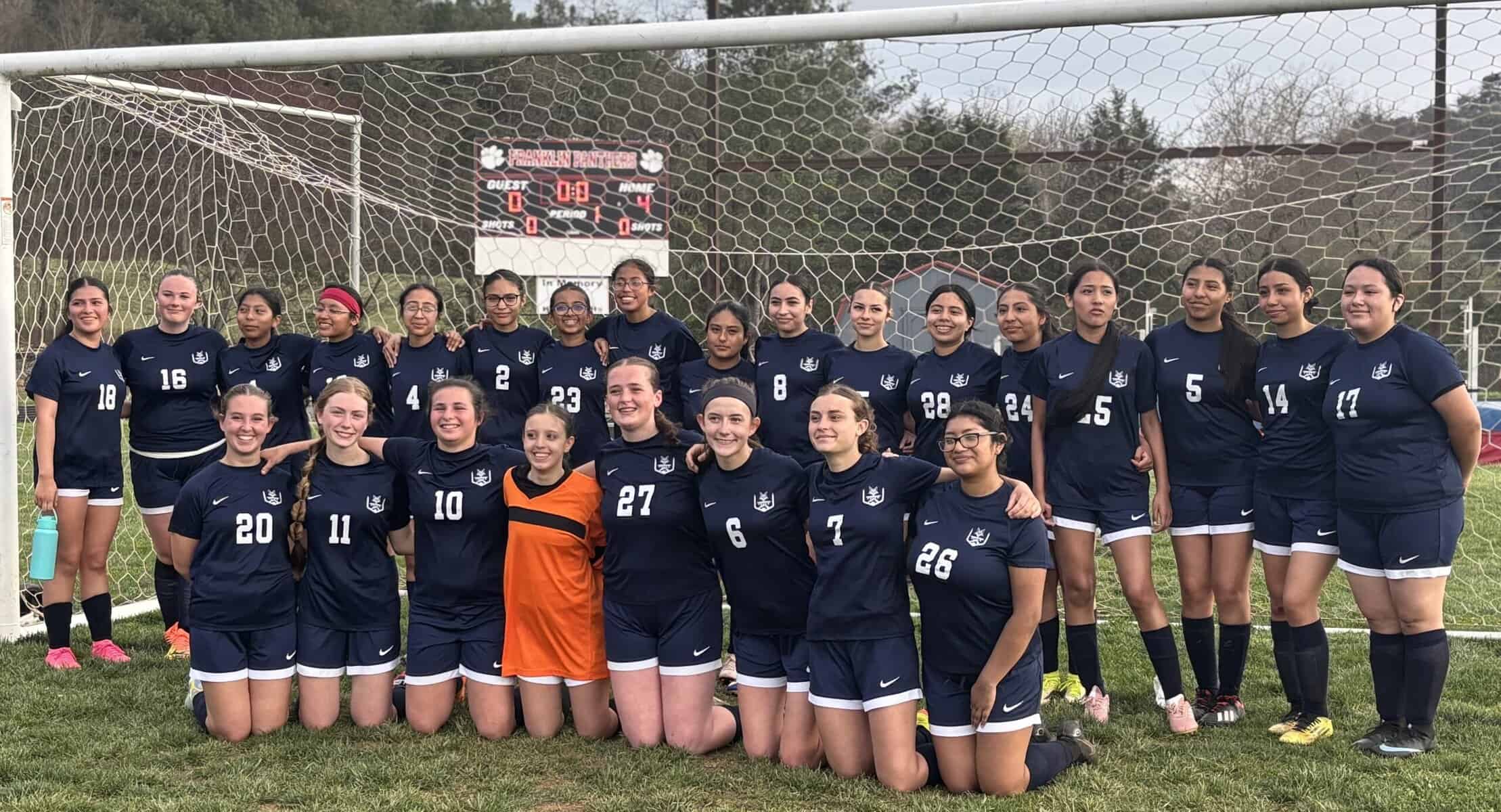Macon Sense girls' soccer team celebrating after a match.