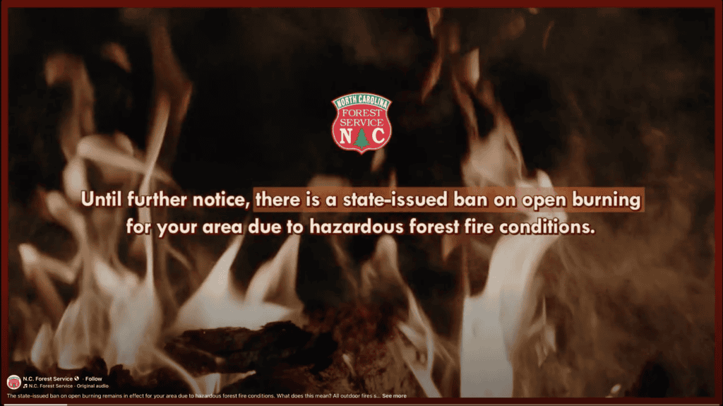 Fire warning sign indicating burn ban due to forest fire risk.