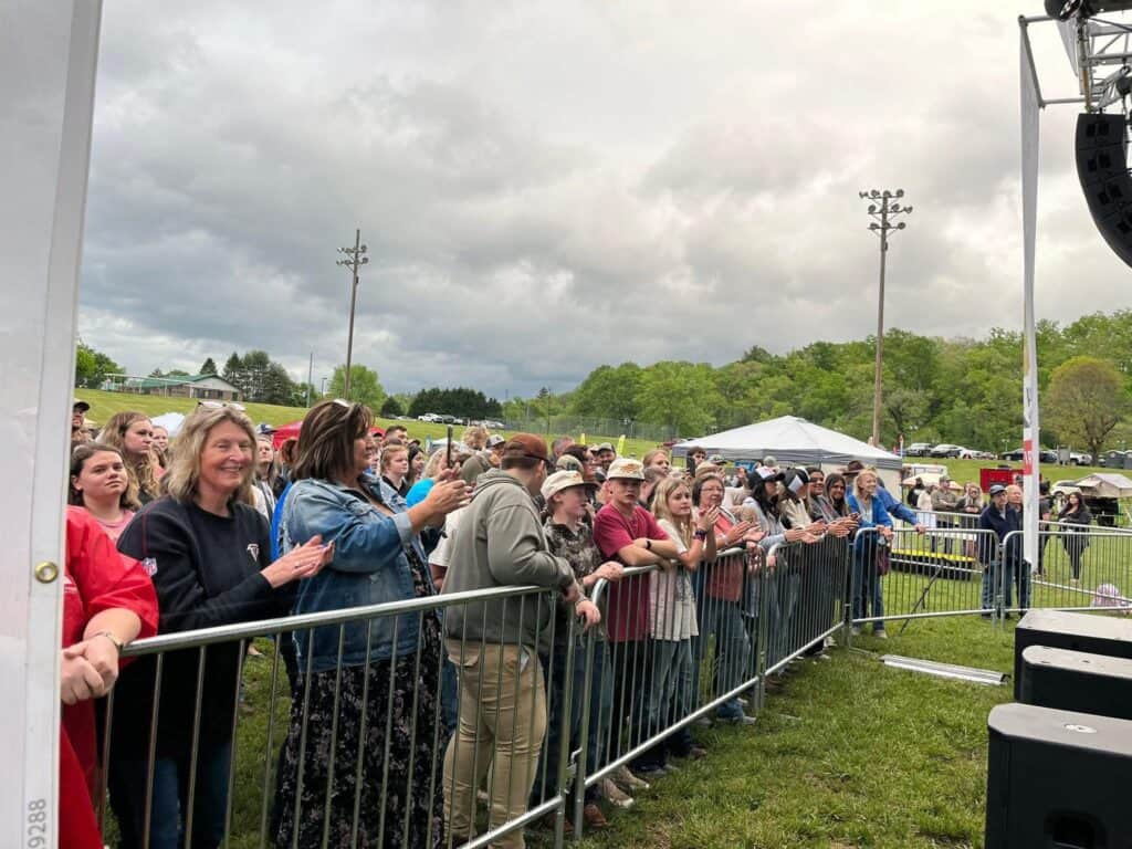 Audience enjoying live music at Macon Sense festival outdoors.