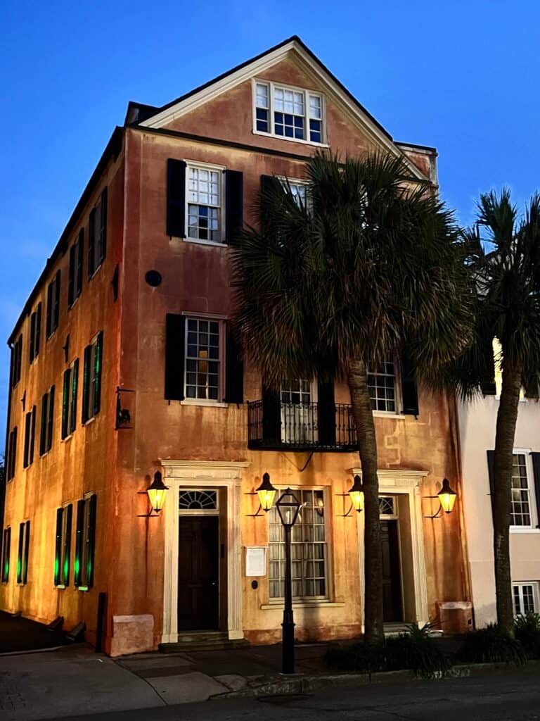 Historic building with palm trees in Charleston, South Carolina.