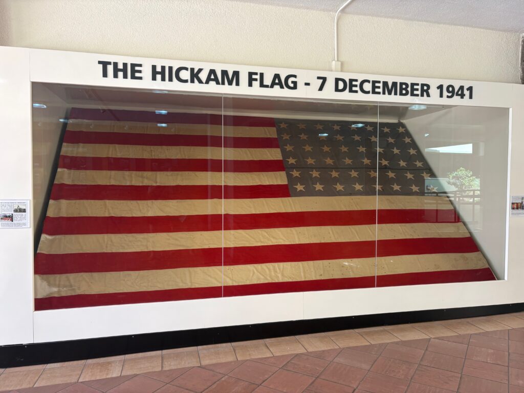 Hickam Flag from December 7, 1941, displayed in glass case.