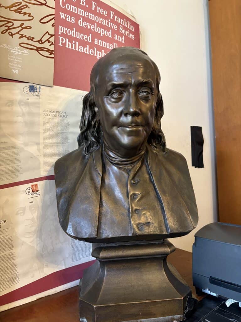 Bronze bust of Benjamin Franklin displayed at Macon Sense museum.
