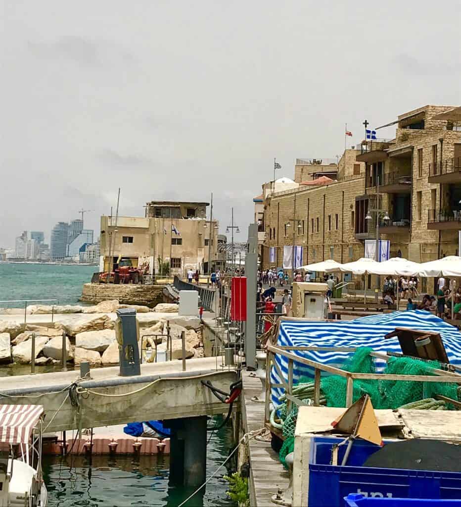 Scenic Beirut waterfront with cafes, boats, and historic architecture along the coast. Perfect for r.