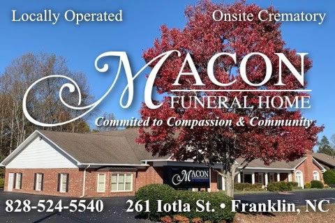 Exterior of Macon Funeral Home with a large red tree in front.