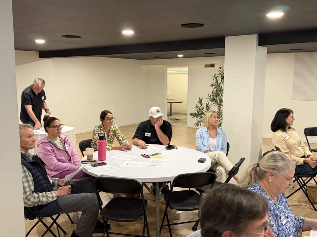 Community members discuss future development plans in downtown Franklin.