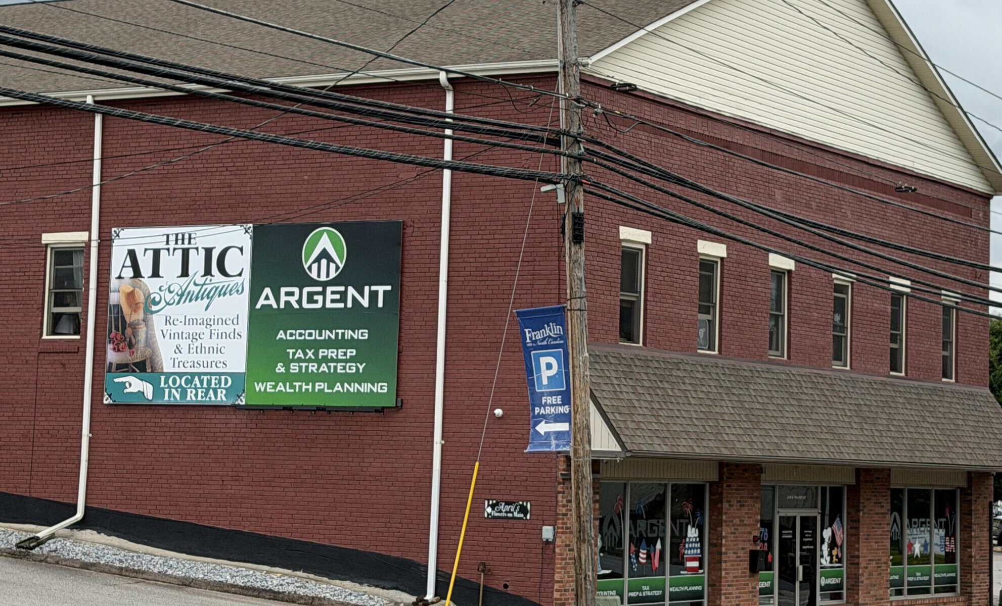 Argent financial services office building with signage and parking lot.
