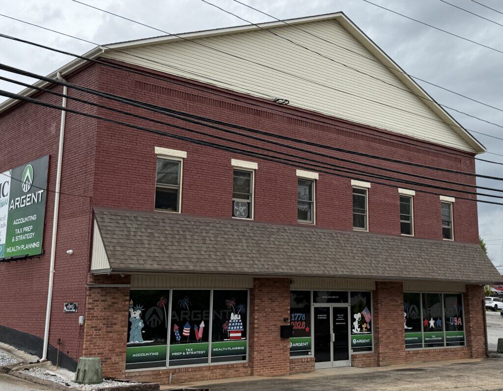 Commercial building with Macon Sense signage and window graphics.
