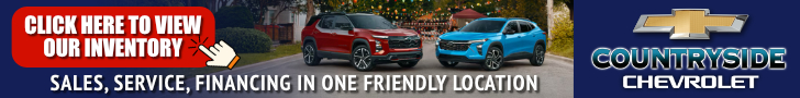 Chevrolet cars displayed at Macon Sense dealership with a promotional banner.