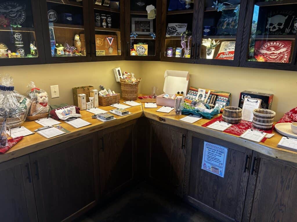 Display of gifts and items for VETS celebration event at Macon Sense.